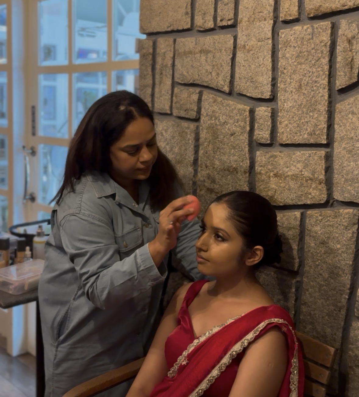 Client getting bridal makeup done